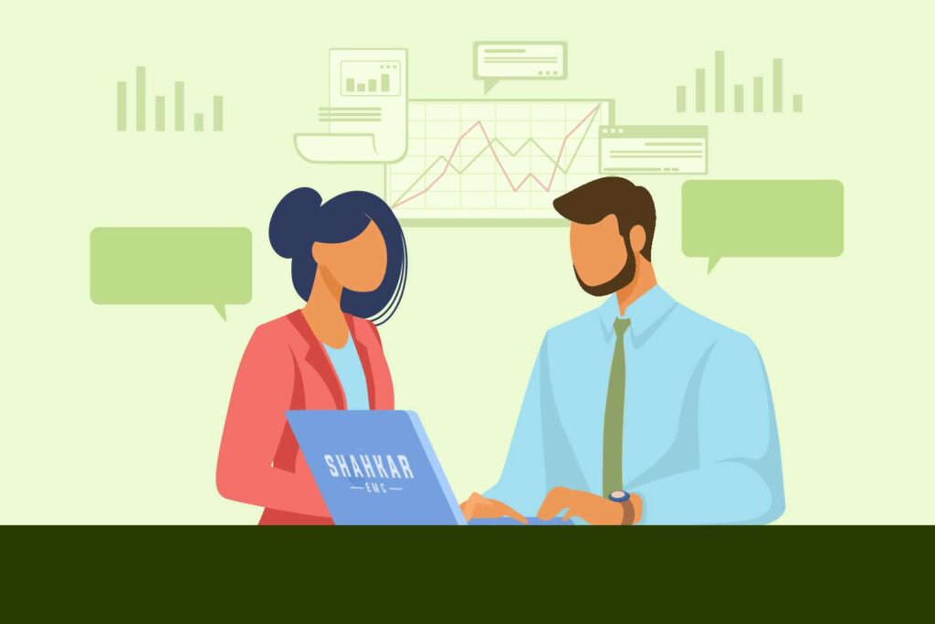 a man consulting with a woman with a laptop front it with brand name shahkar emc on it